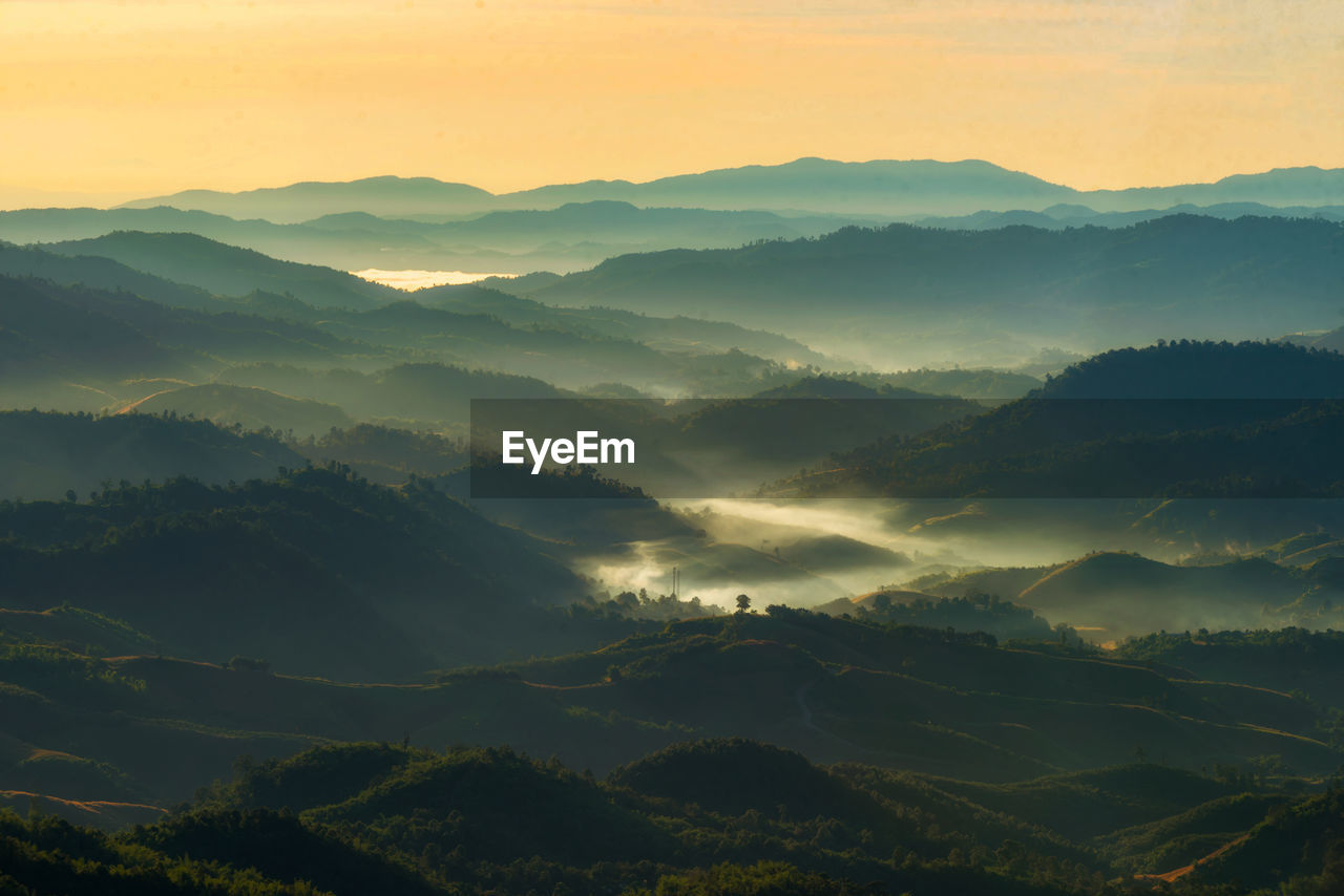 Scenic view of mountains against sky during sunset