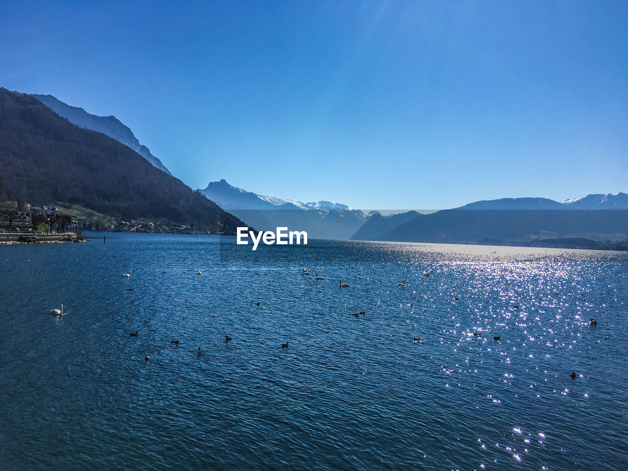 Scenic view of sea against clear blue sky