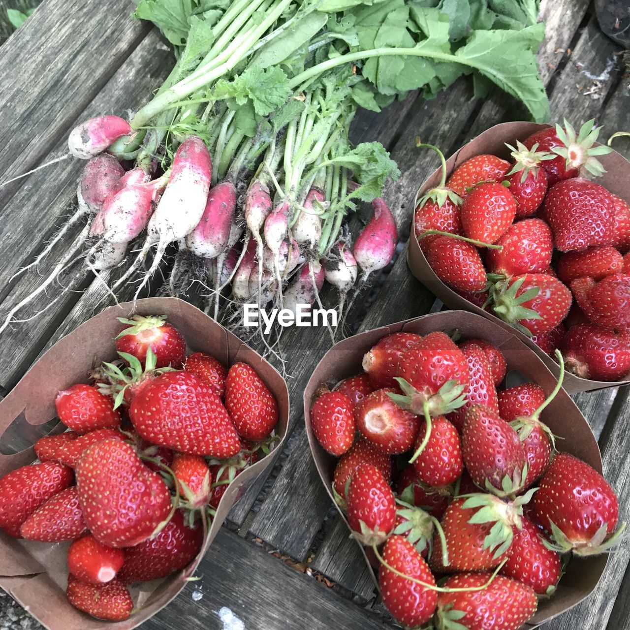HIGH ANGLE VIEW OF STRAWBERRIES IN BASKET ON BOWL