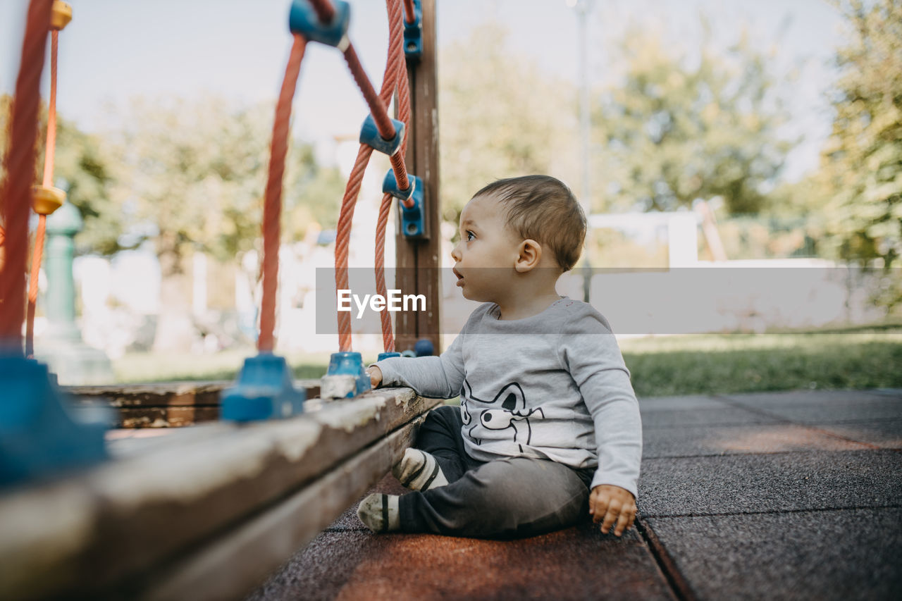 Boy looking away in the playground