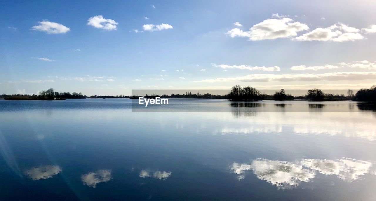 IDYLLIC SHOT OF LAKE AGAINST SKY