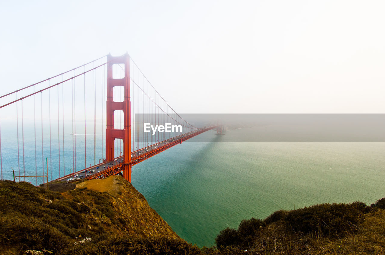 High angle view of golden gate bridge over sea during foggy weather