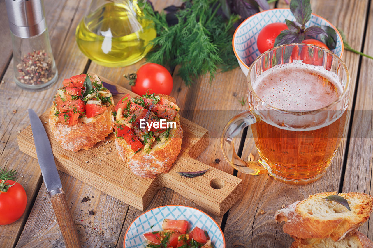 Italian bruschetta with chopped tomatoes, basil, beer and olive oil on grilled crusty bread