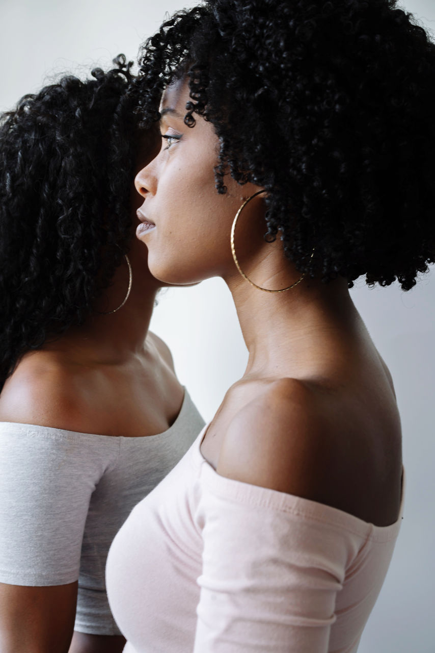 Two beautiful african women opposite each other portrait