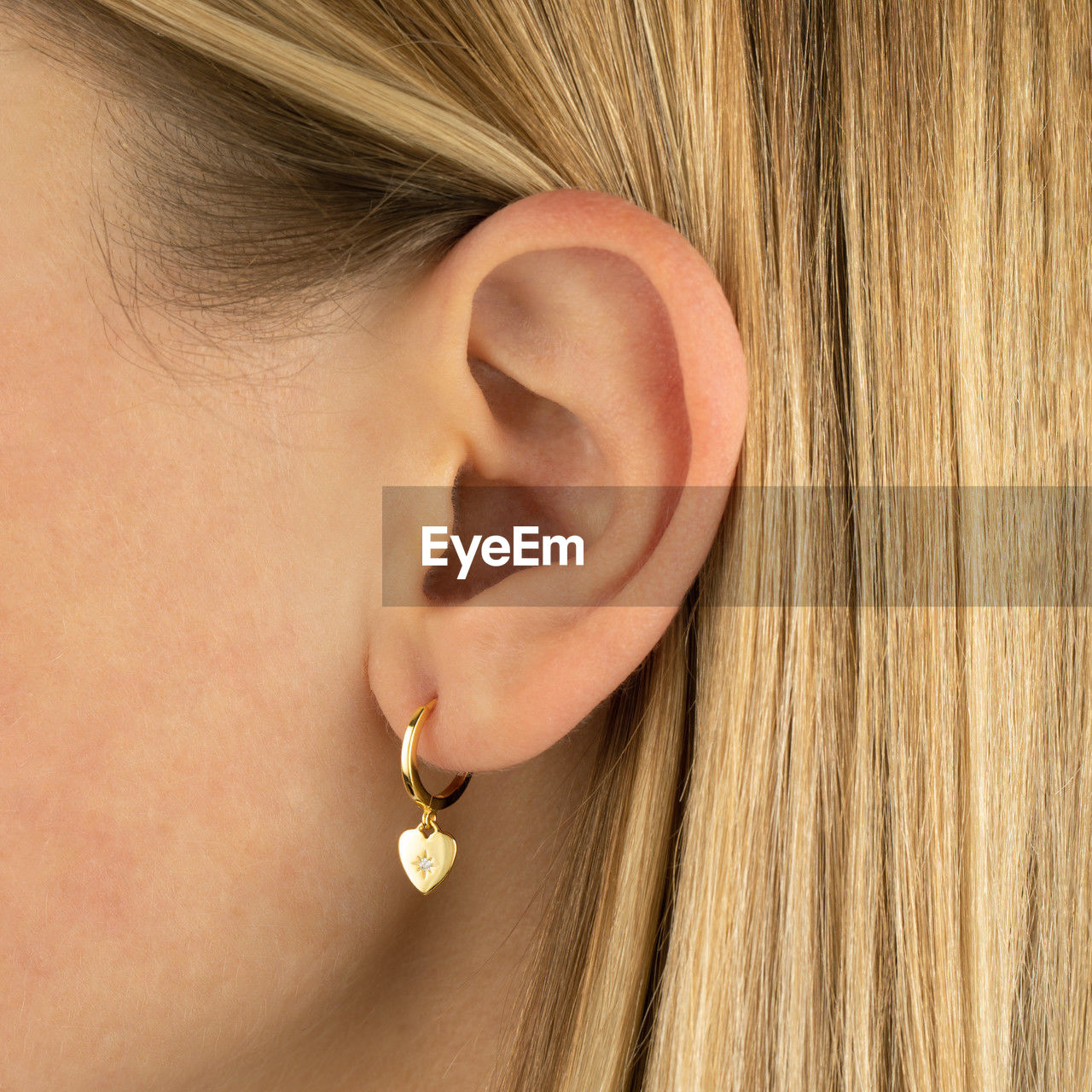 one person, women, close-up, human face, nose, adult, earring, jewelry, fashion, young adult, human hair, lip, blond hair, fashion accessory, hairstyle, indoors, portrait, long hair, wealth, female, human eye, jewellery, skin, lifestyles, headshot, body piercing, child, brown, studio shot, luxury, emotion