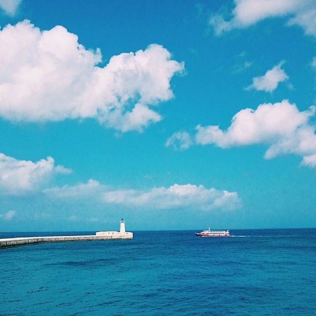 SCENIC VIEW OF SEASCAPE AGAINST CLOUDY SKY