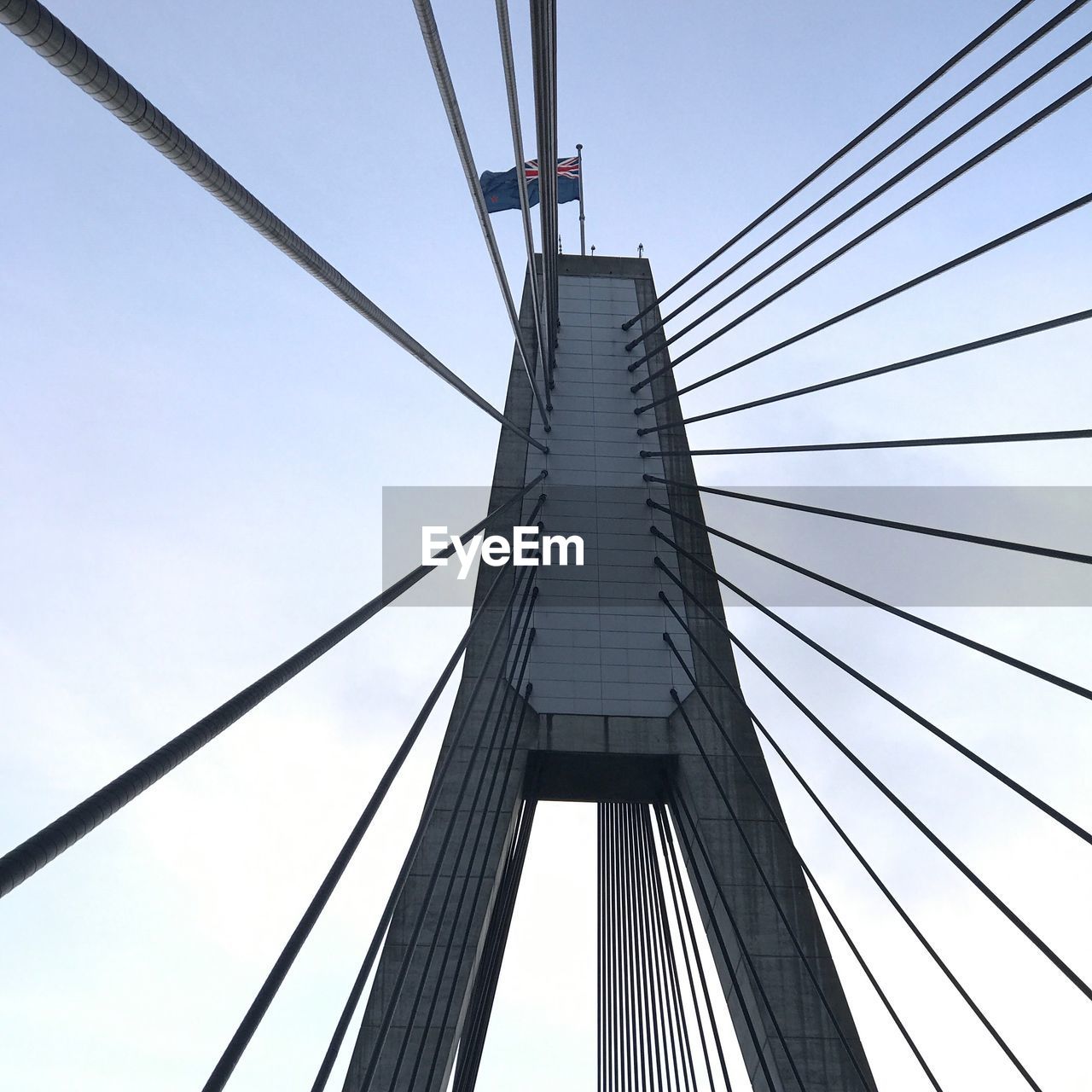 Low angle view of suspension bridge against clear sky