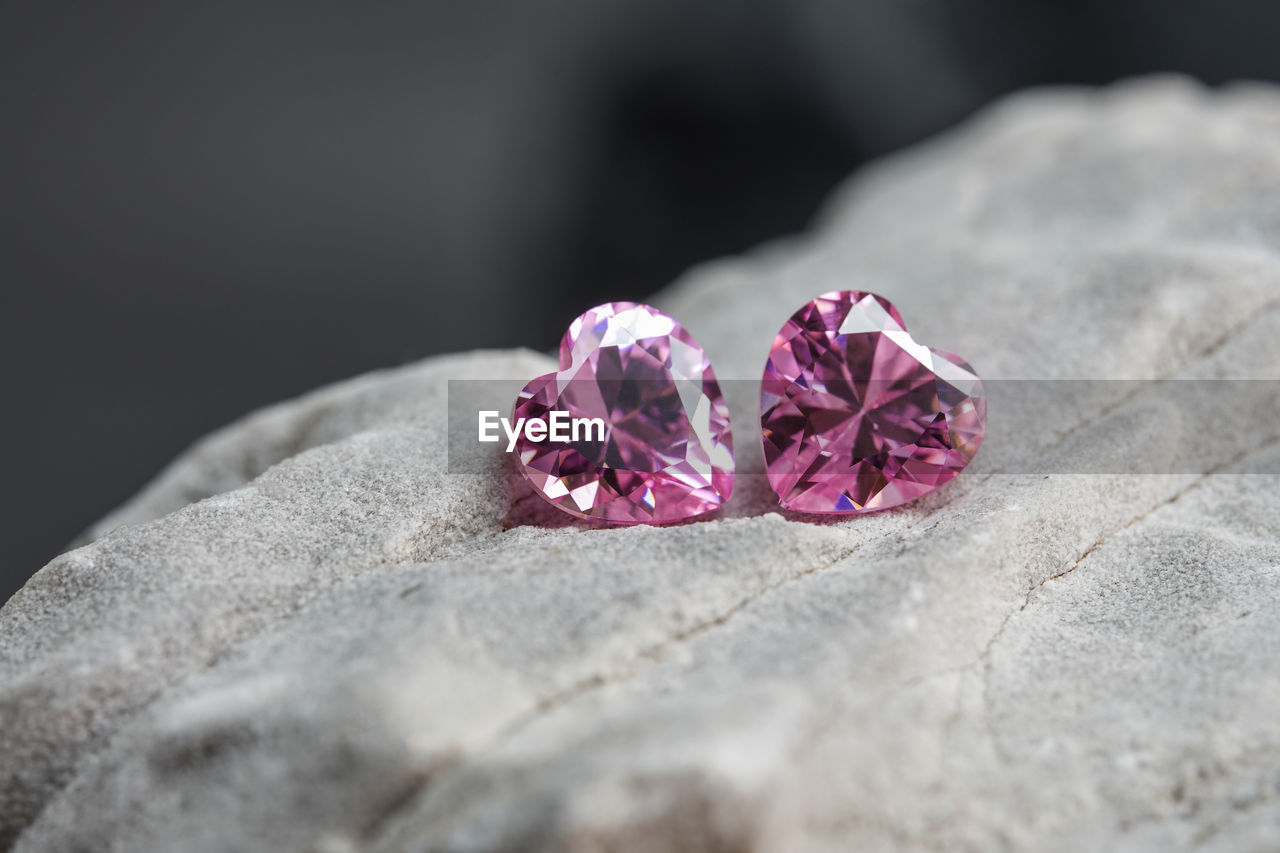 close-up, jewellery, pink, petal, macro photography, flower, fashion accessory, nature, selective focus, no people, beauty in nature, flowering plant, red, rock, plant, ring, outdoors, still life, freshness