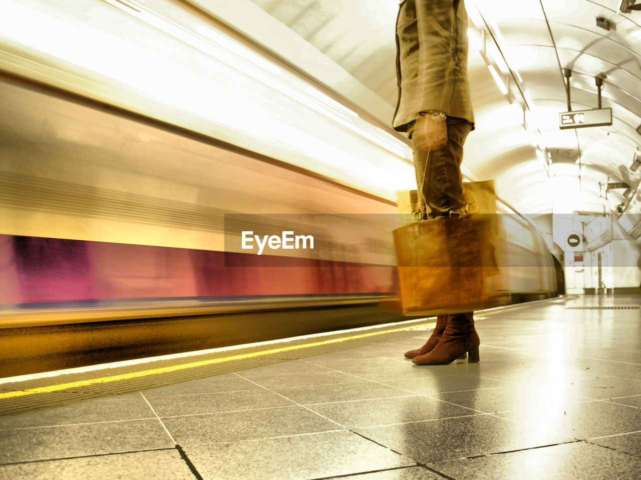 Blurred motion of train at railroad station