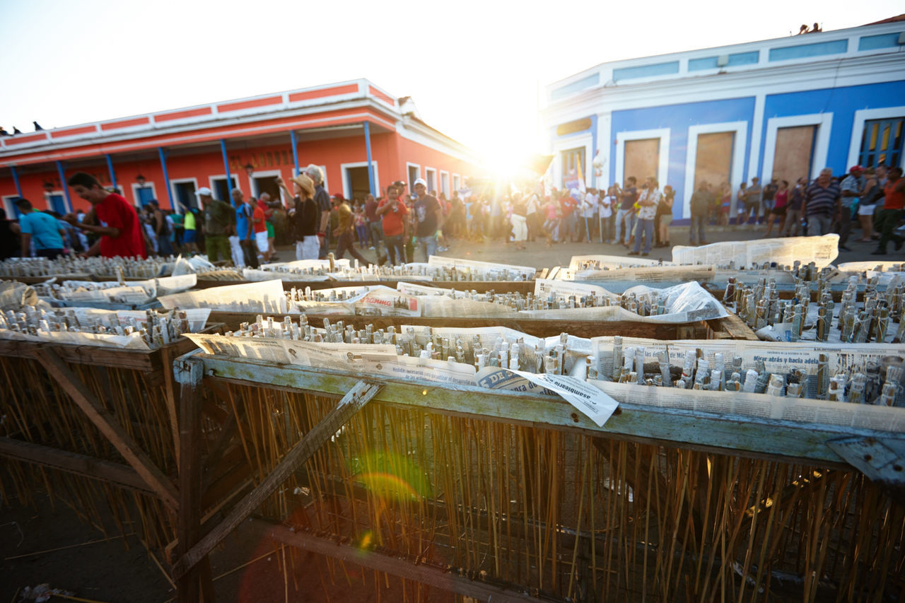 PANORAMIC VIEW OF PEOPLE IN FRONT OF BUILDINGS