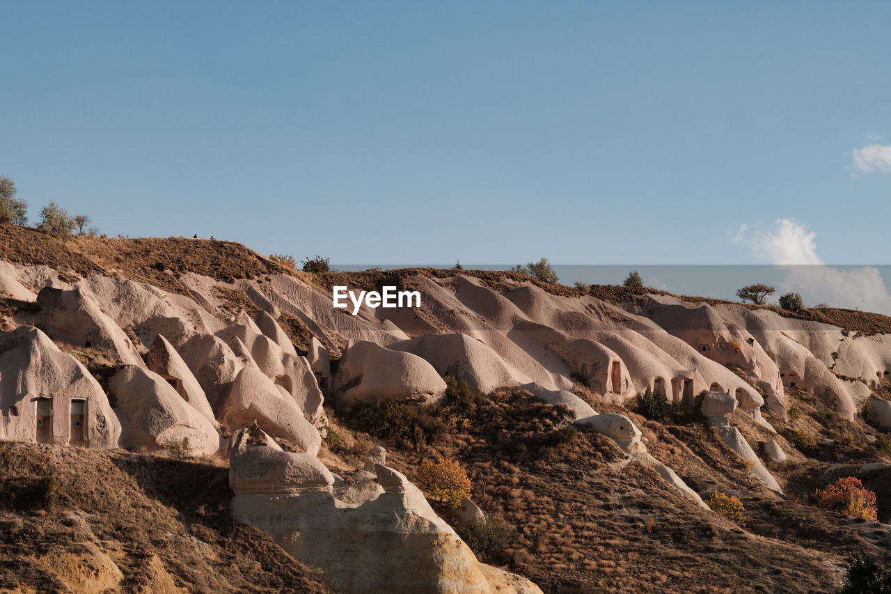 Scenic view of rocky mountains against clear sky