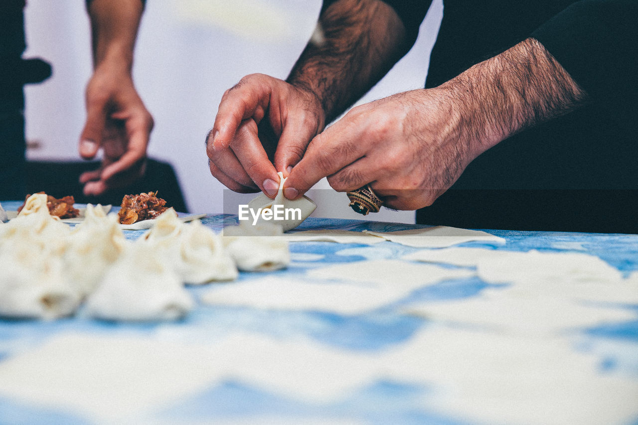 Mid section of a man preparing snacks