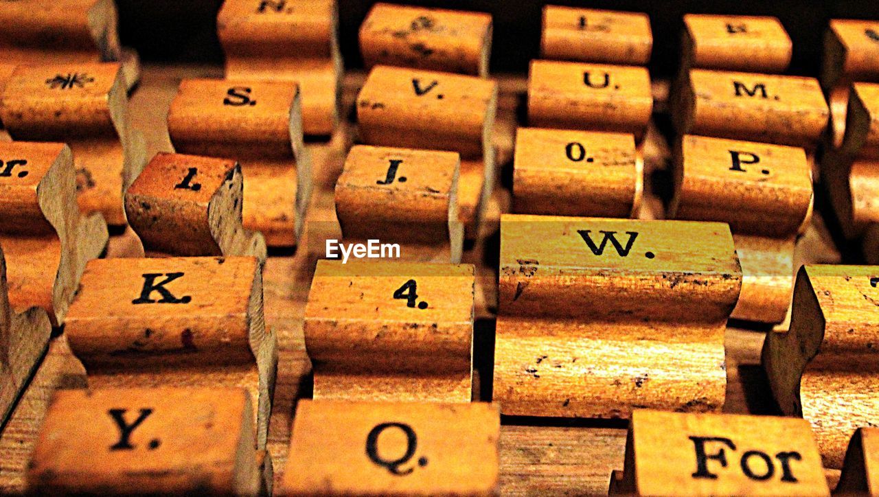 Close-up of letters on wooden printing blocks