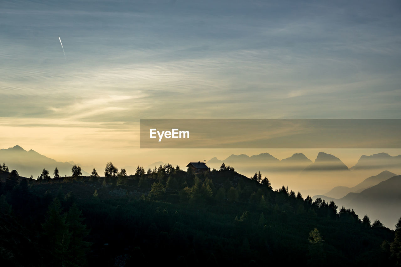 SCENIC VIEW OF MOUNTAINS AGAINST SKY DURING SUNSET