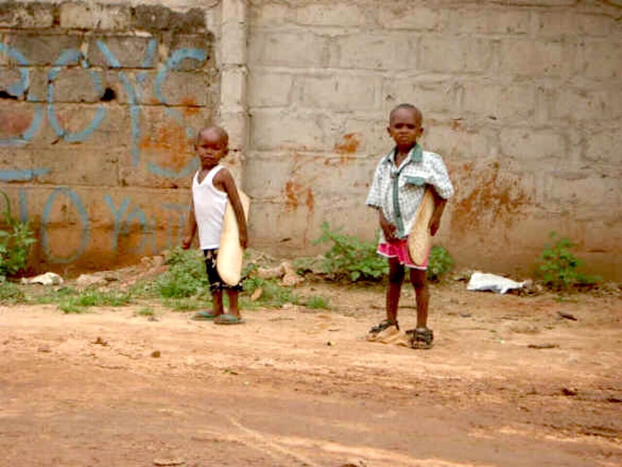 FULL LENGTH OF GIRL PLAYING WITH STONE