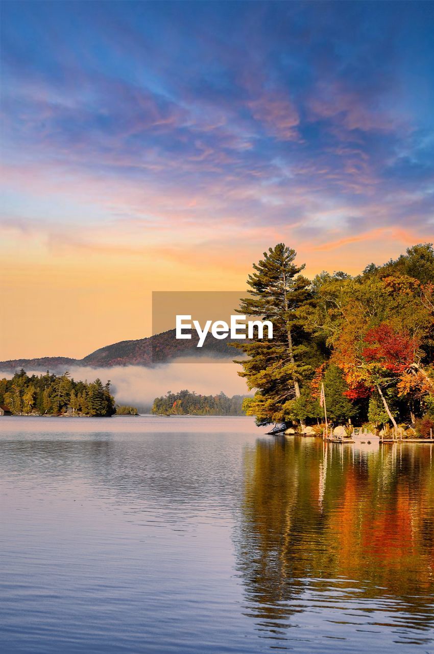 Scenic view of lake against sky during sunset