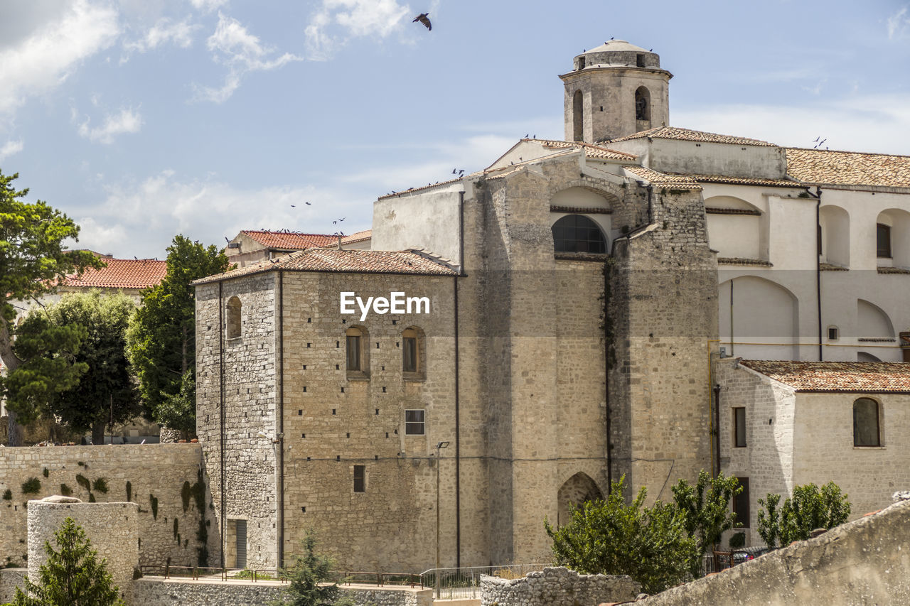 OLD BUILDING AGAINST SKY