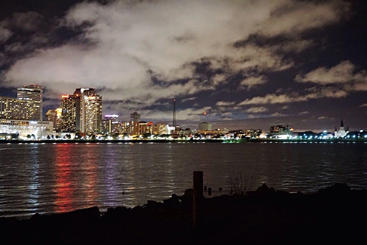 ILLUMINATED CITYSCAPE AT NIGHT