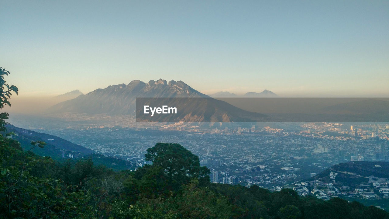 Scenic view of mountains against sky at sunset