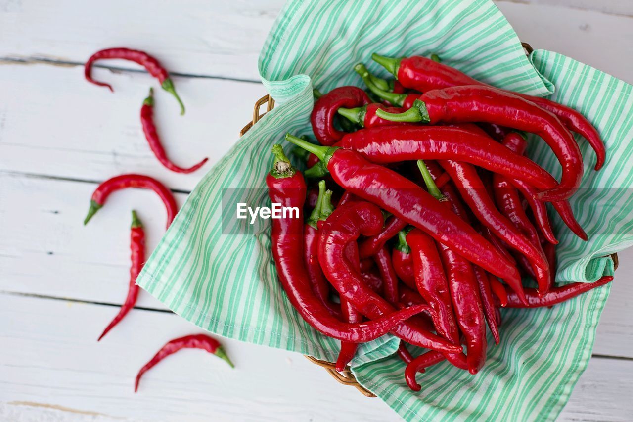 High angle view of red chili peppers on table