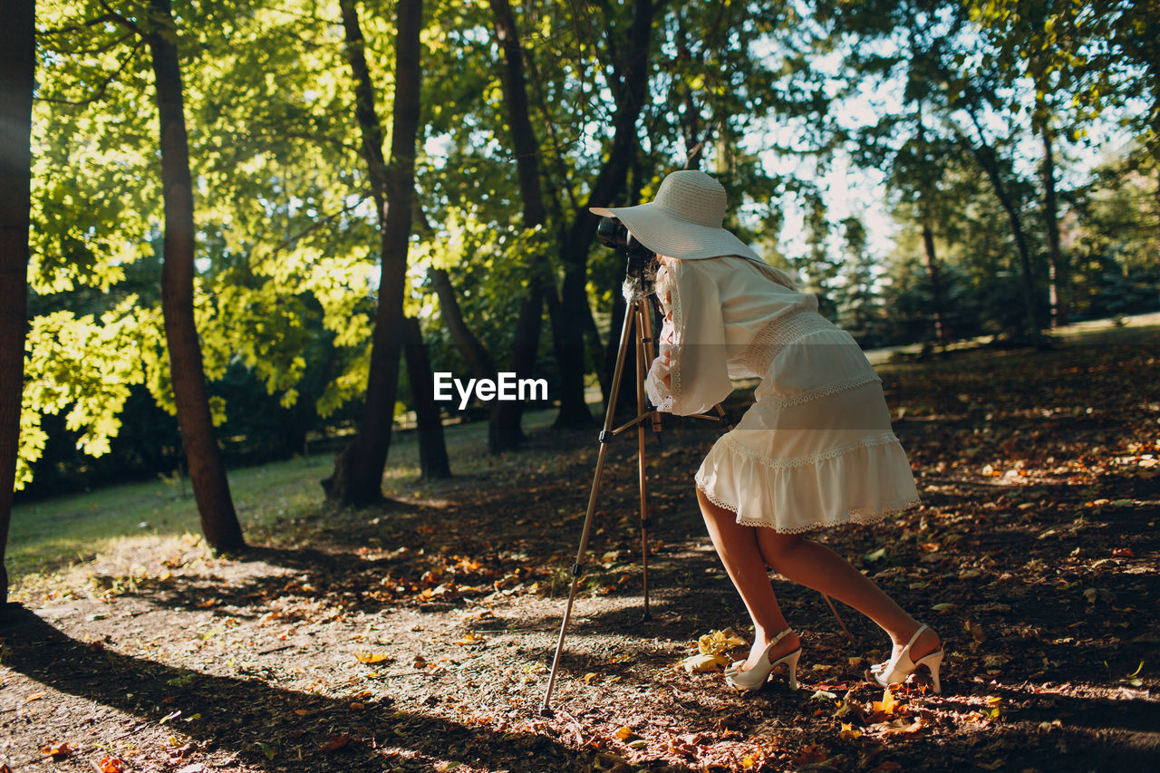 Side view of woman walking in park