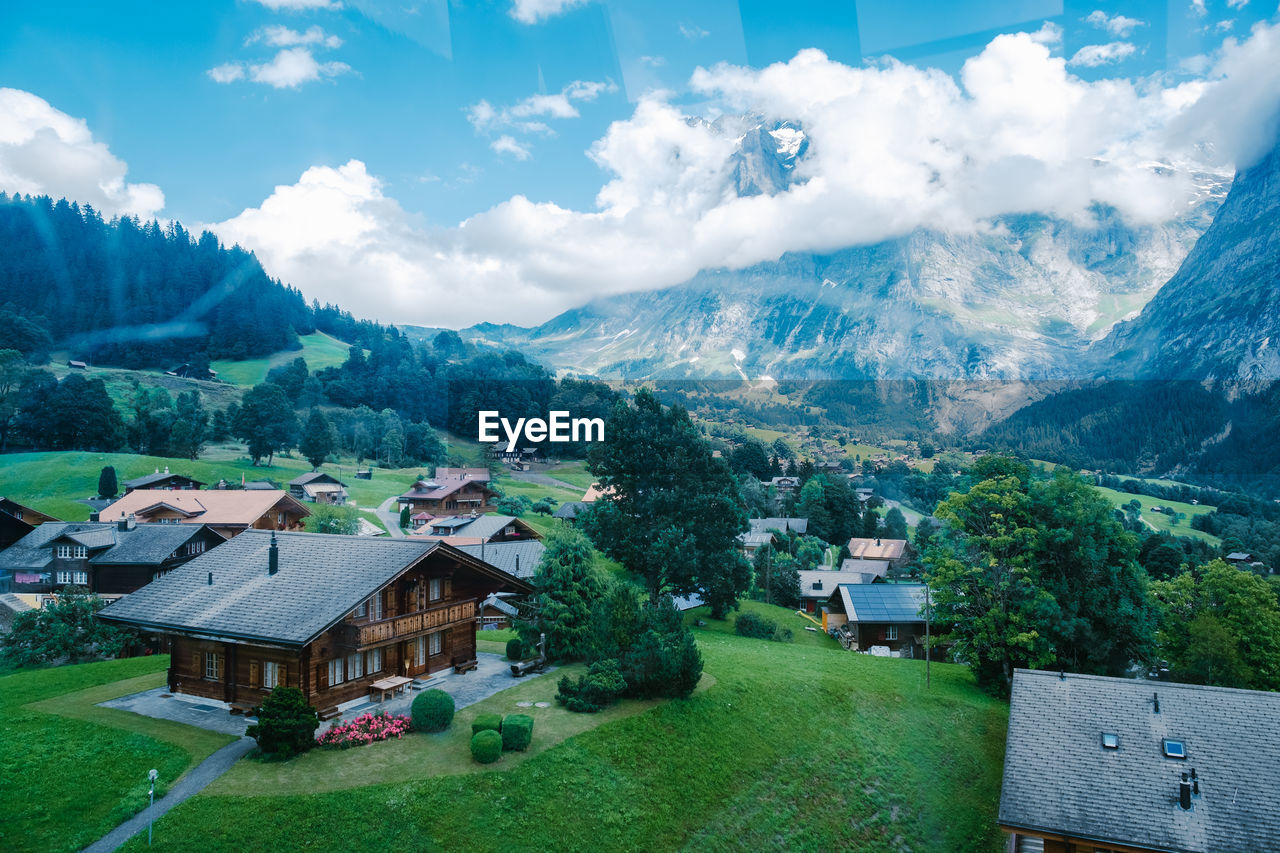 SCENIC VIEW OF LANDSCAPE AND BUILDINGS AGAINST SKY