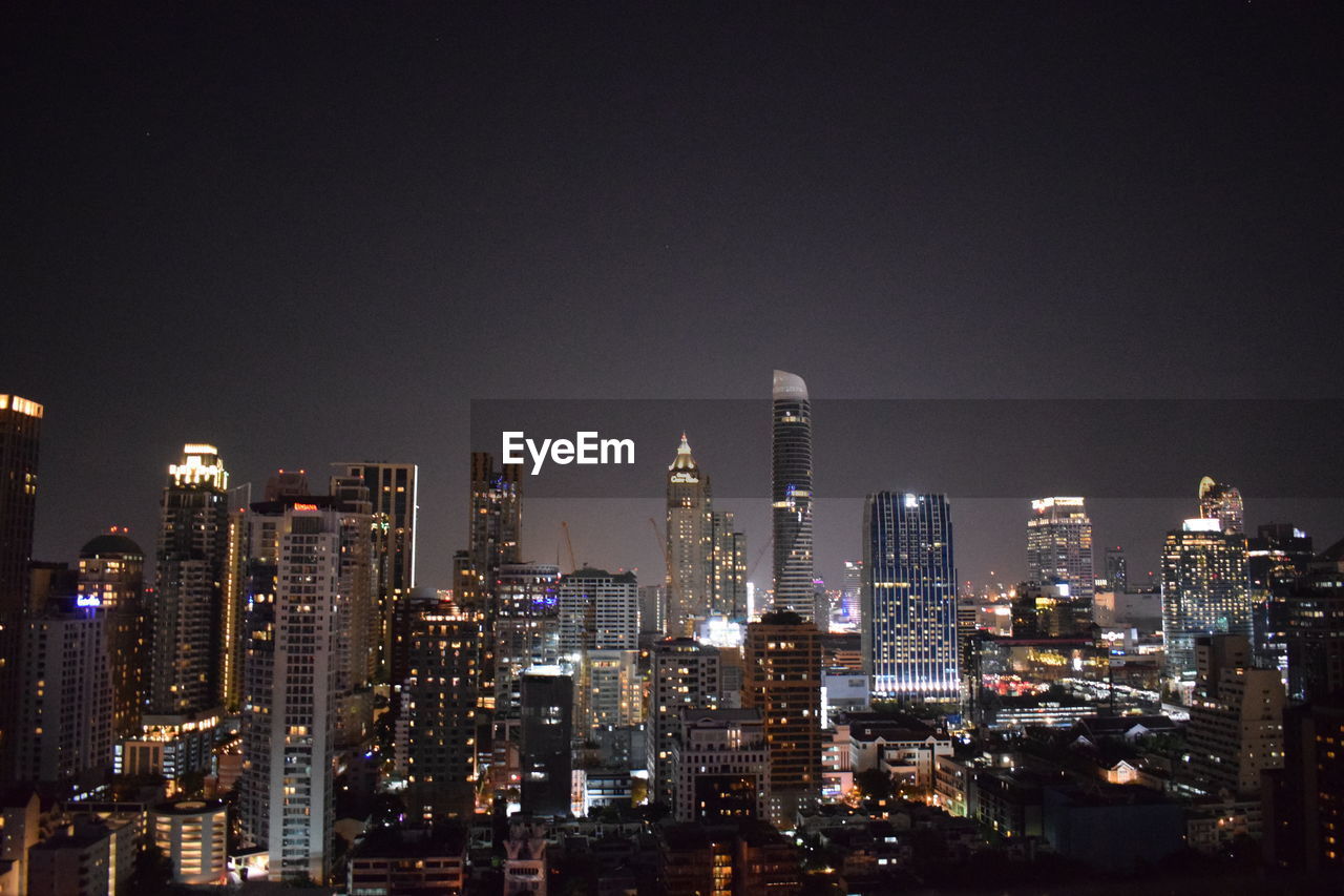 Illuminated buildings in city at night