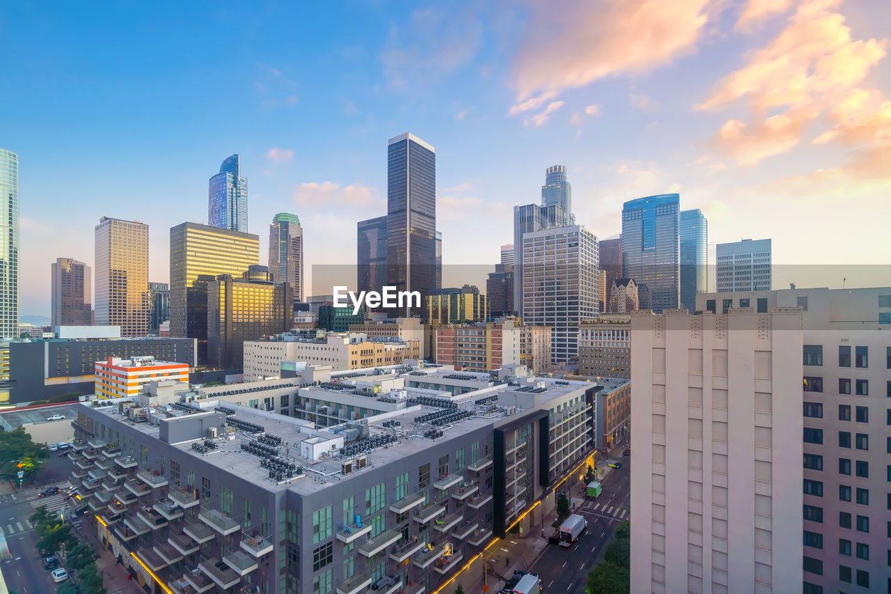 BUILDINGS IN CITY AGAINST SKY