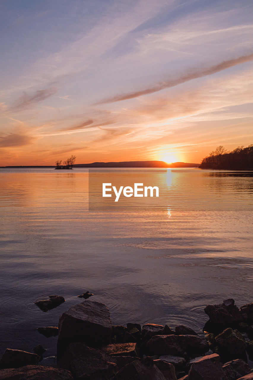 Scenic view of sea against sky during sunset