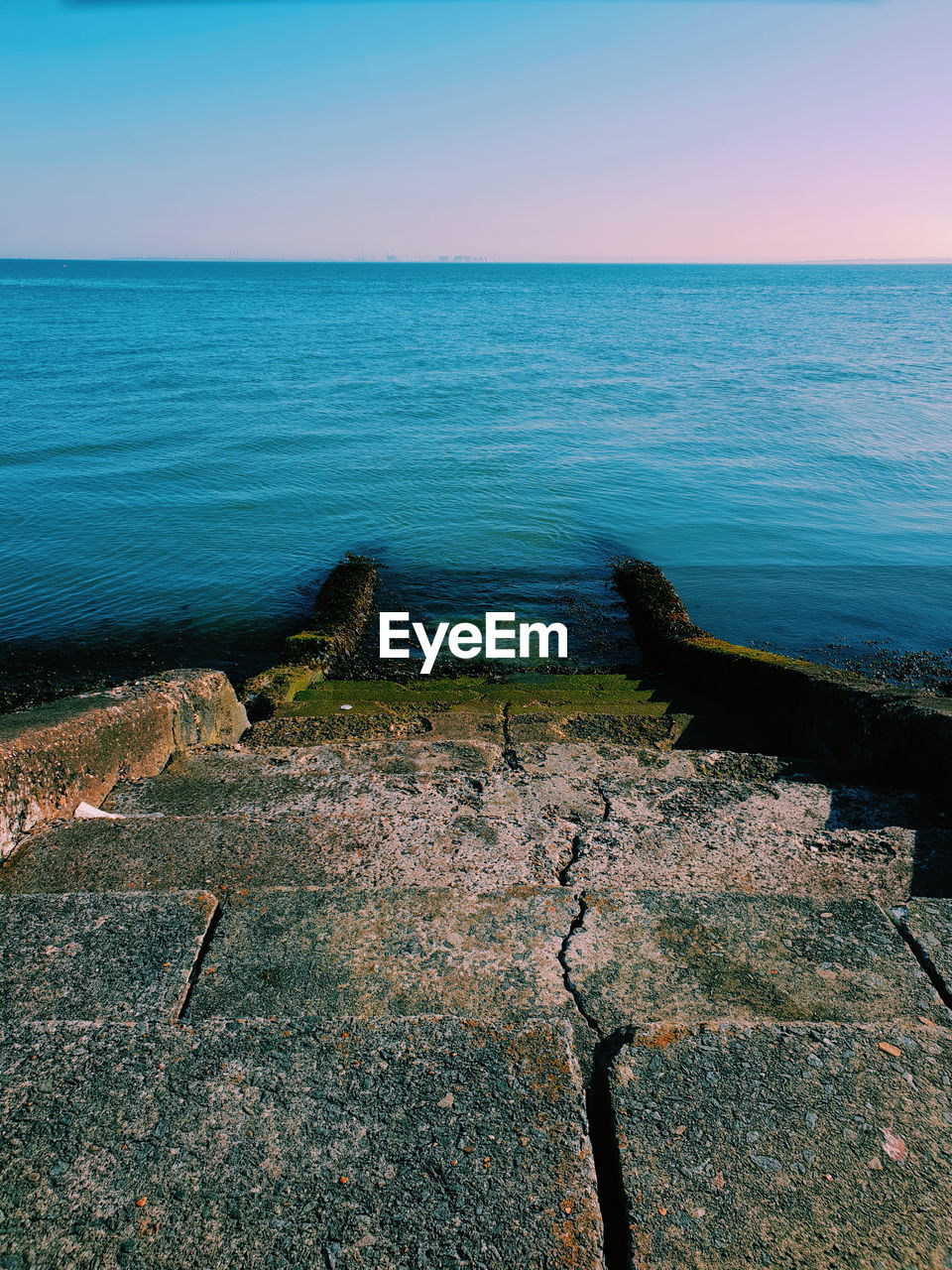 SCENIC VIEW OF BLUE SEA AGAINST CLEAR SKY