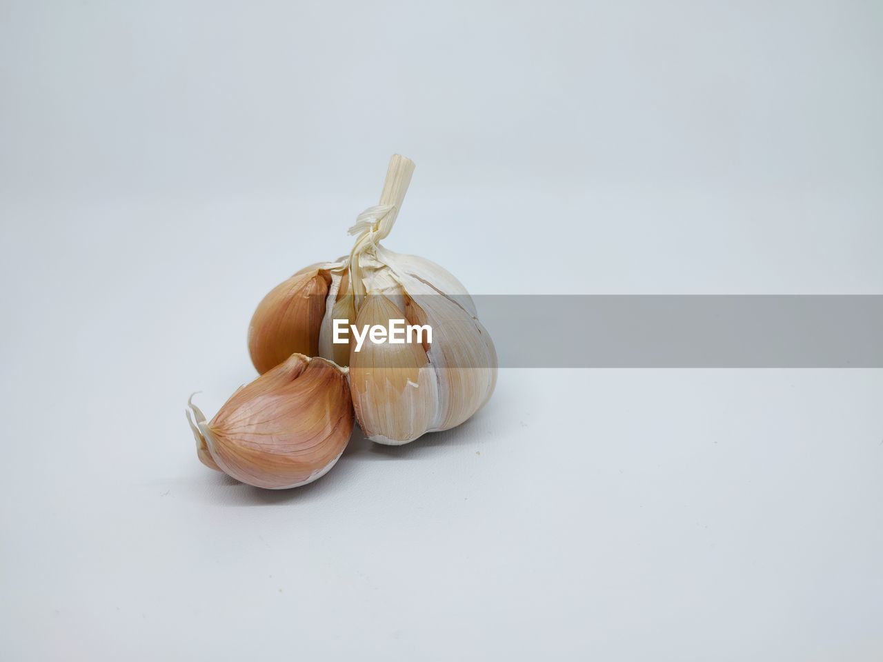 CLOSE-UP OF BREAD ON WHITE BACKGROUND