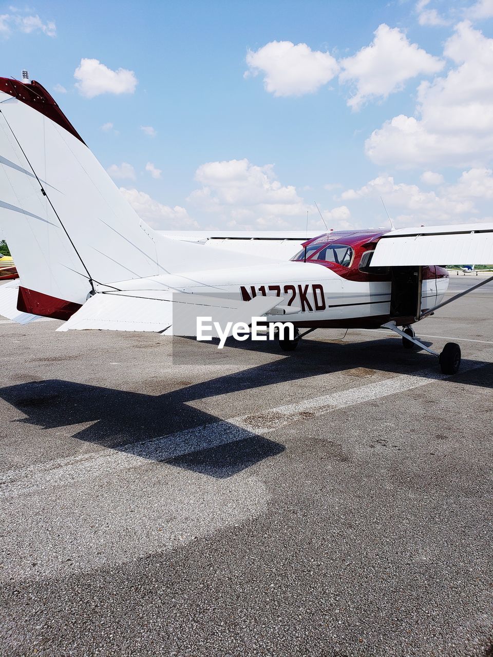 VIEW OF AIRPLANE ON AIRPORT RUNWAY