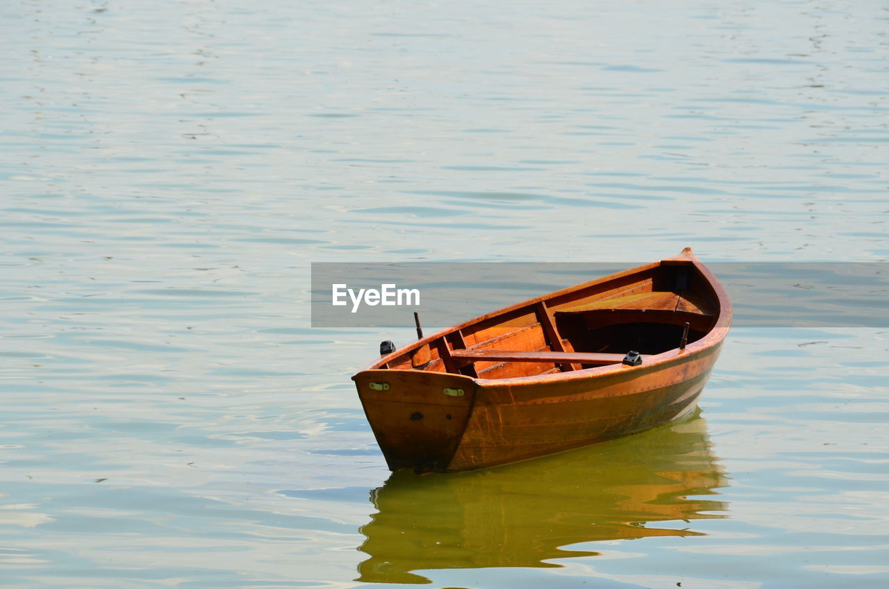 Boat moored on lake