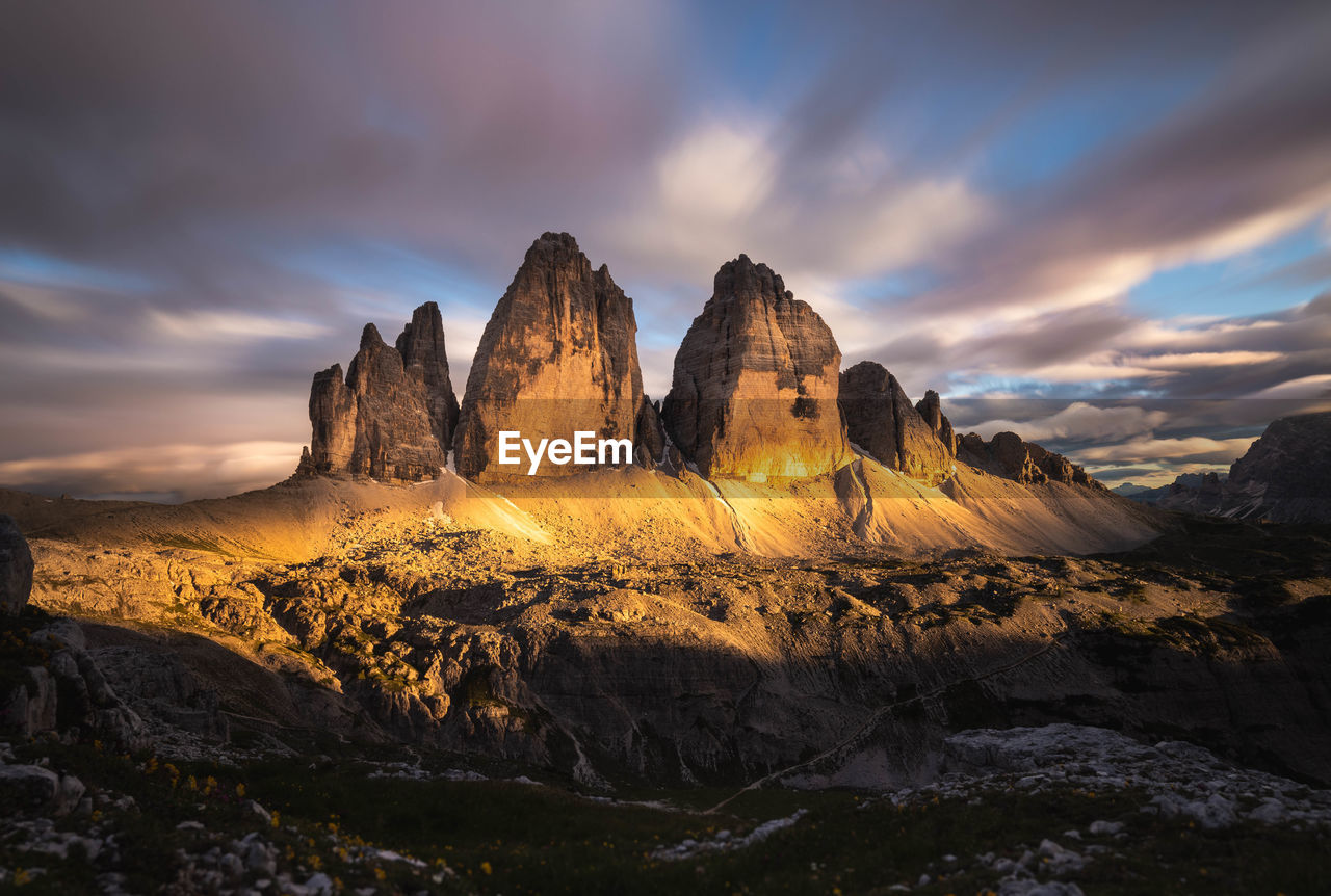 Rock formations against sky during sunset