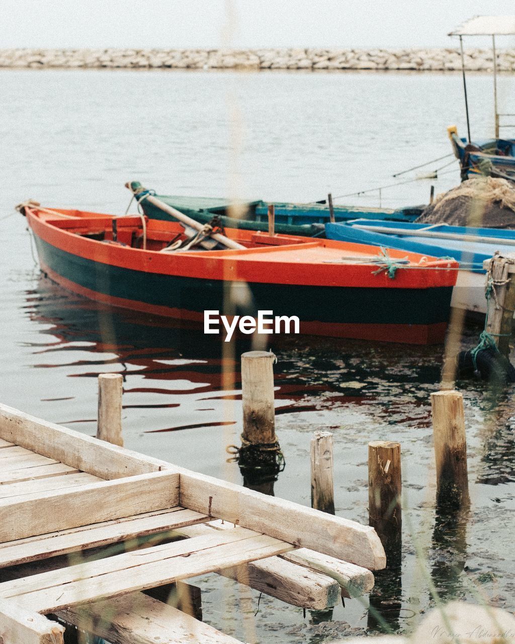 Fishing boat moored at sea shore