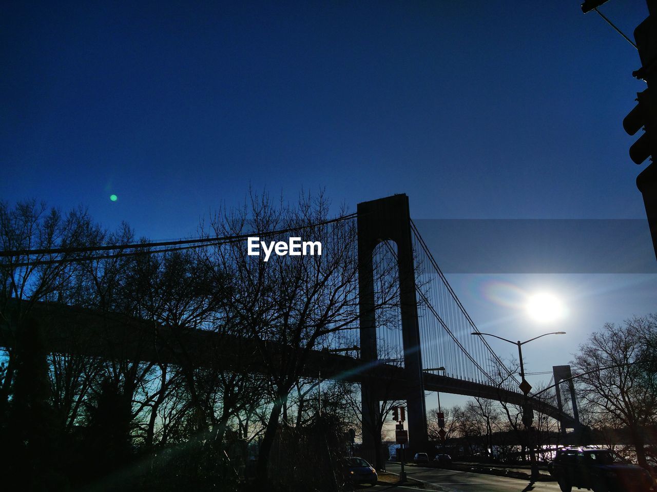 LOW ANGLE VIEW OF SUSPENSION BRIDGE AGAINST SKY