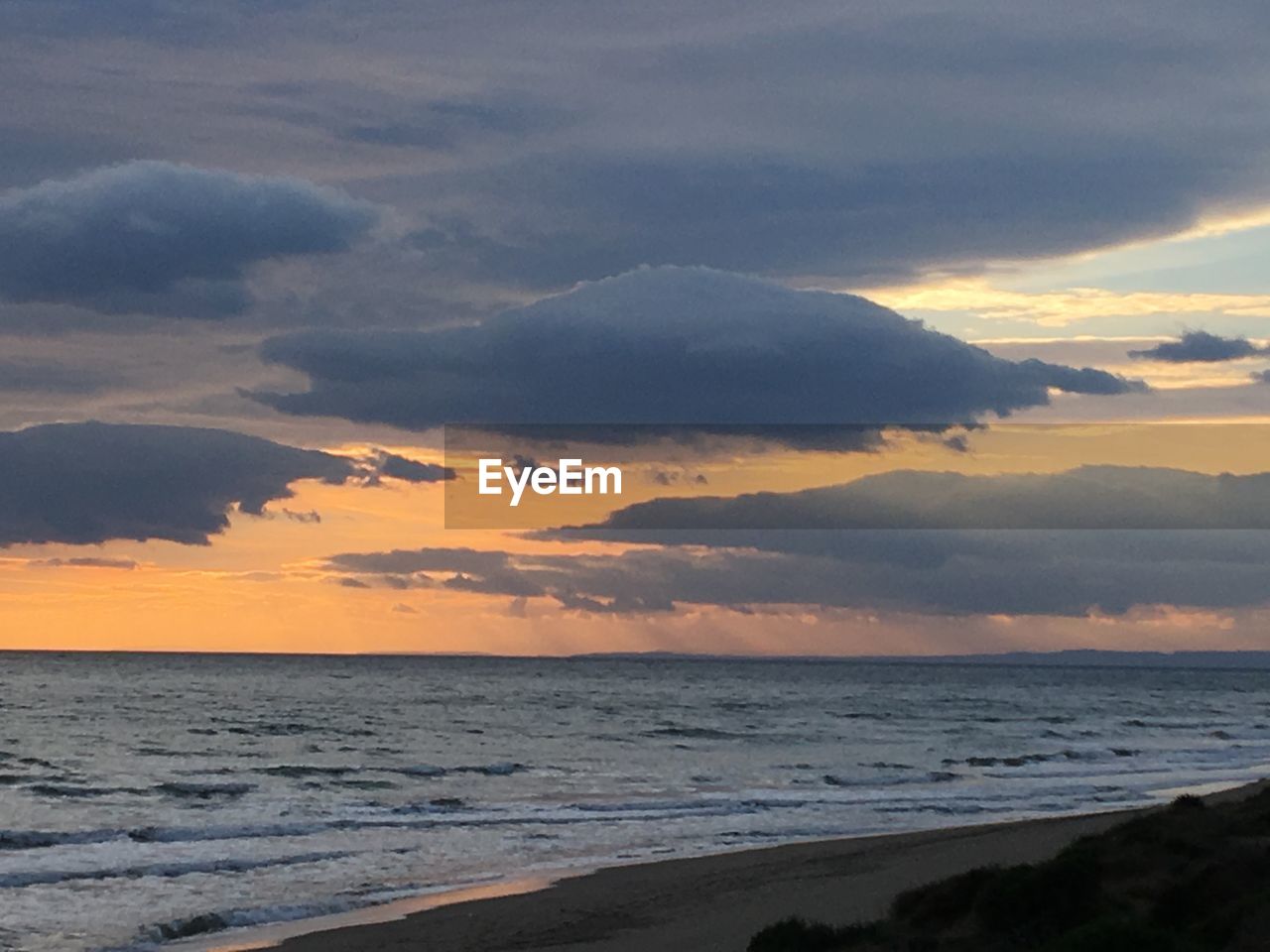 SCENIC VIEW OF SEA DURING SUNSET