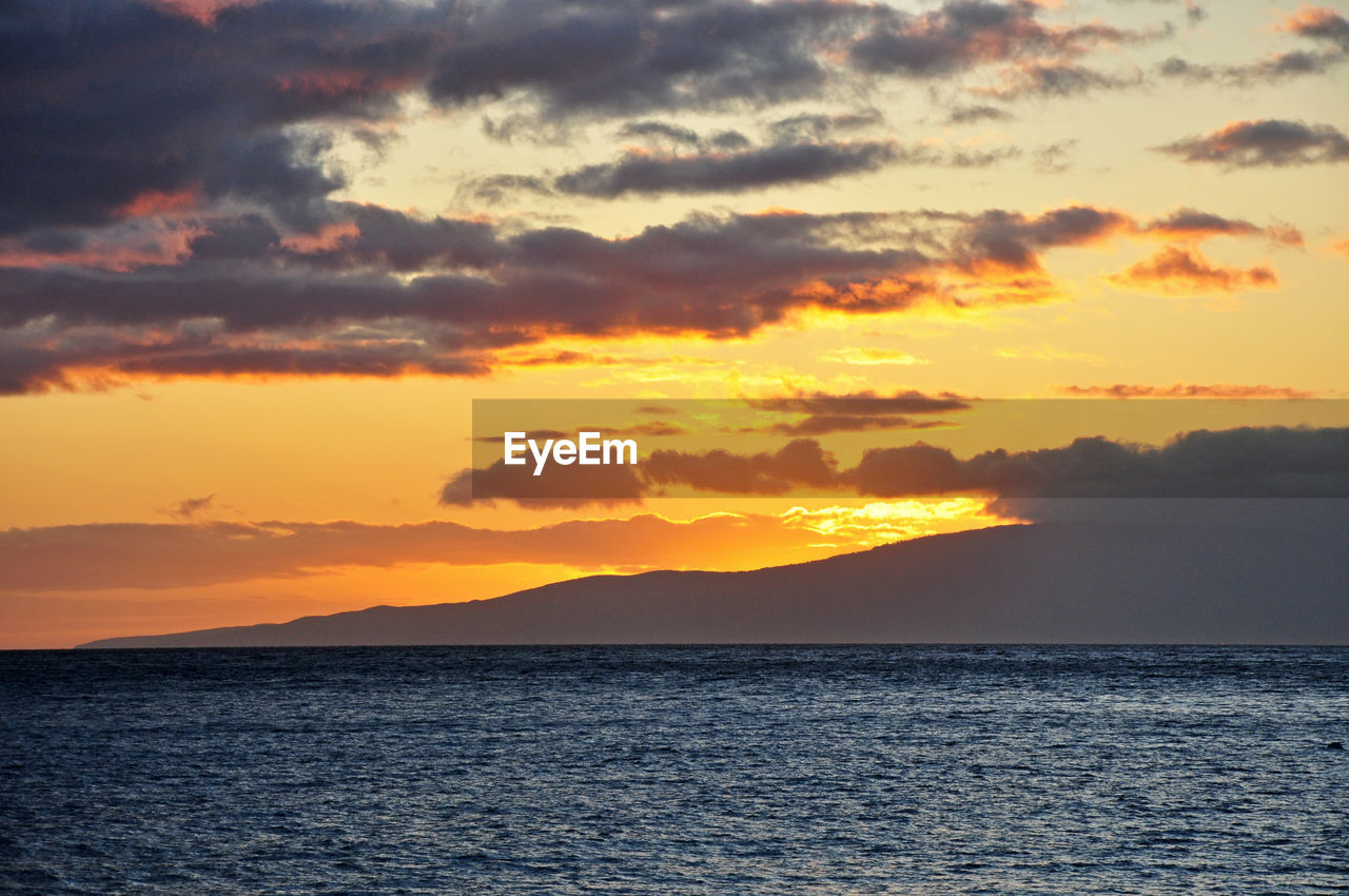 Scenic view of sea against sky during sunset