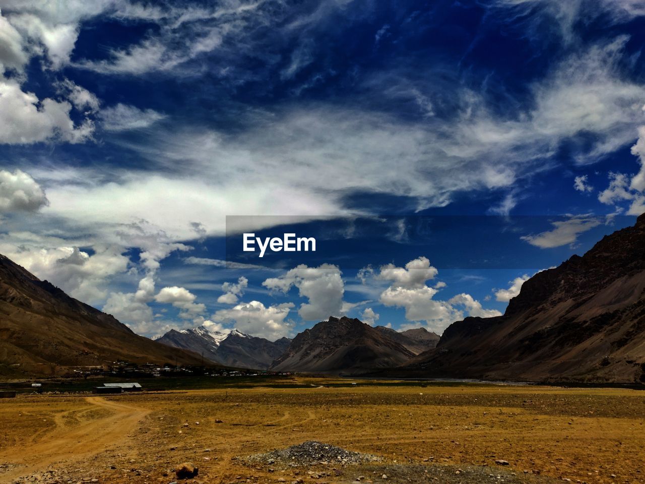 Scenic view of landscape and mountains against sky