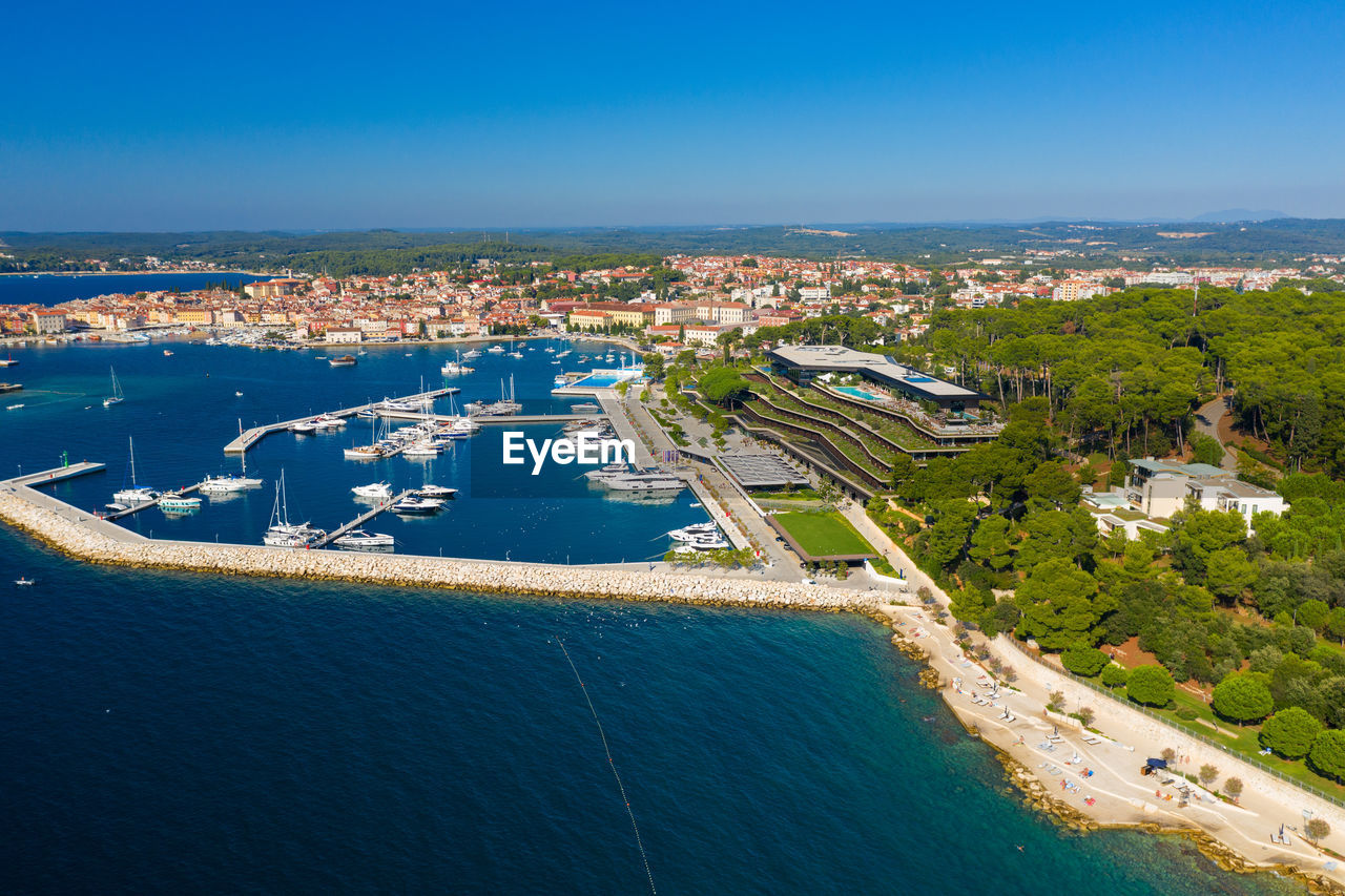 High angle view of city by sea against blue sky in the town of rovinj