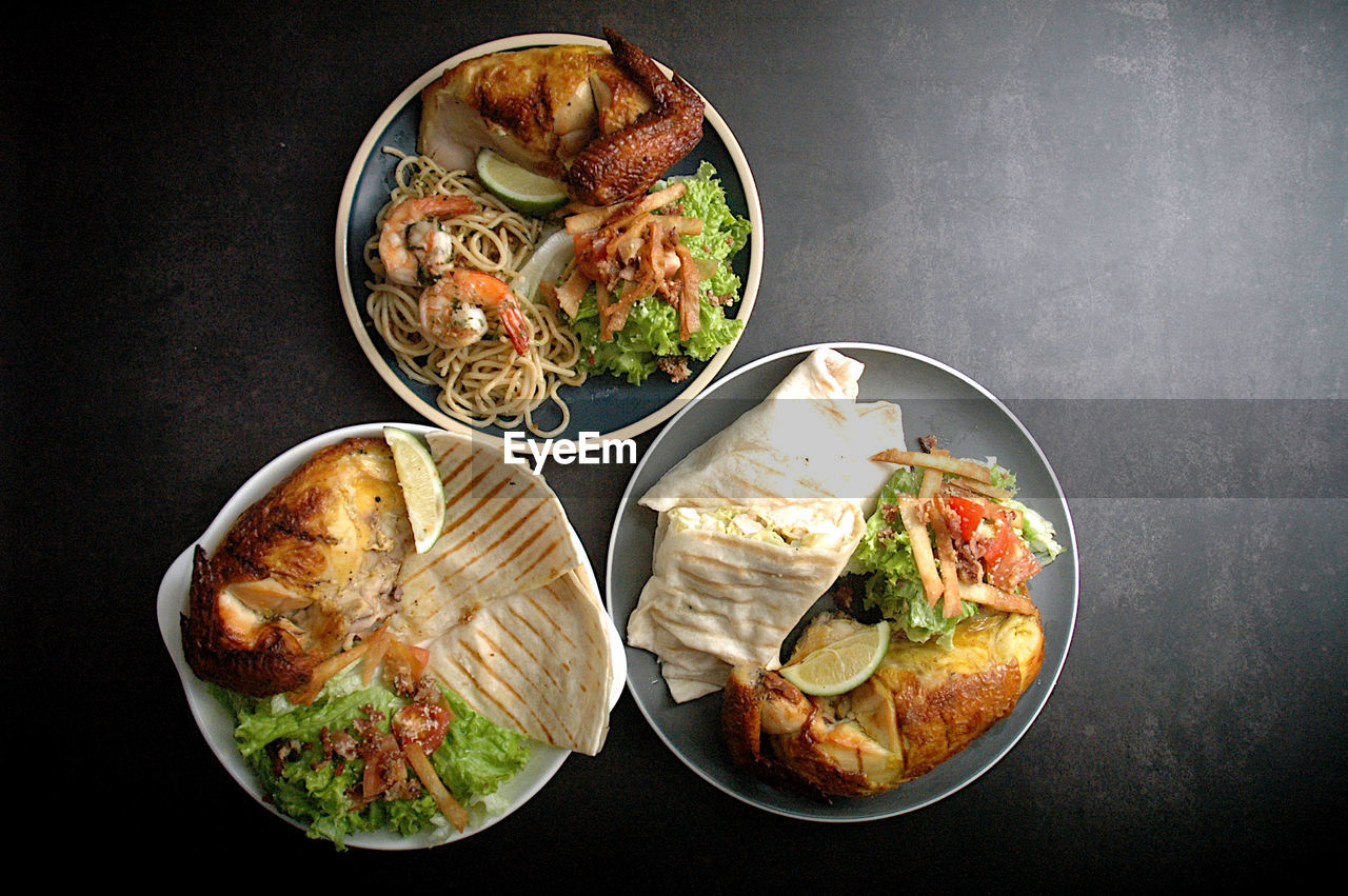 High angle view of food on table against black background