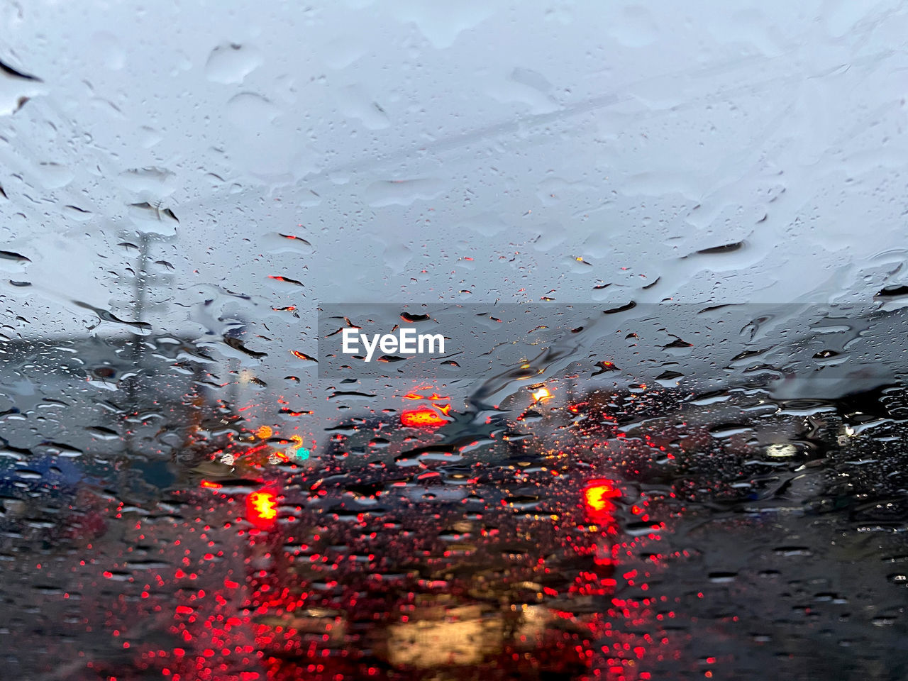 rain, wet, drop, water, glass, window, transportation, mode of transportation, car, nature, transparent, motor vehicle, rainy season, no people, raindrop, vehicle interior, monsoon, land vehicle, outdoors, snow, full frame, car interior, city, sky, close-up, illuminated, freezing, dusk, travel, traffic, backgrounds, reflection, architecture, road, street, windshield, drizzle