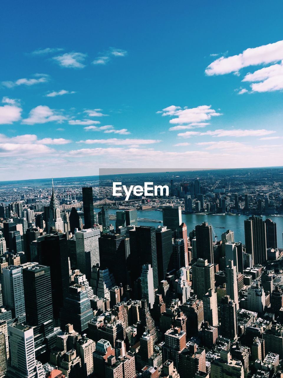 AERIAL VIEW OF CITY BUILDINGS AGAINST SKY