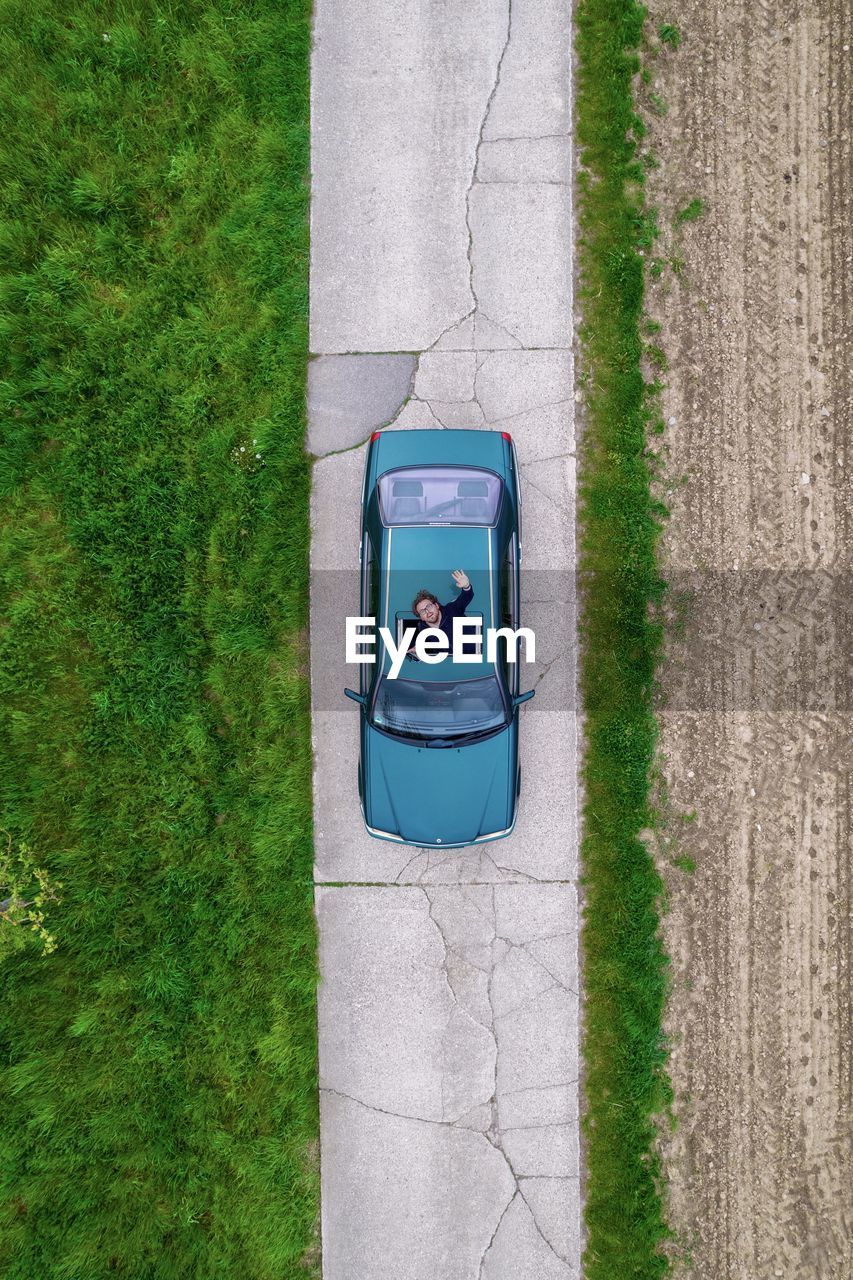 Top view of mercedes car in farmland 