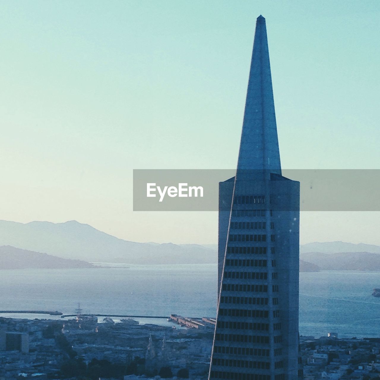 High section of transamerica pyramid against clear sky on sunny day