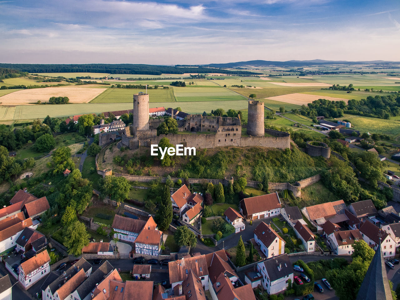 High angle view of houses and historic buildings against sky