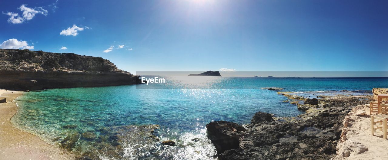 Scenic view of sea against clear blue sky