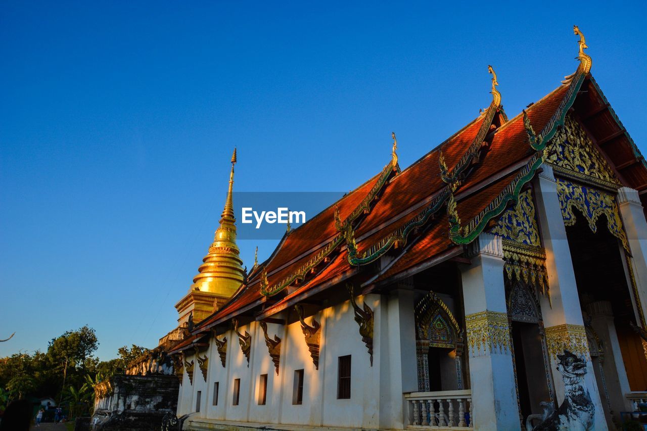 LOW ANGLE VIEW OF TEMPLE AGAINST CLEAR SKY