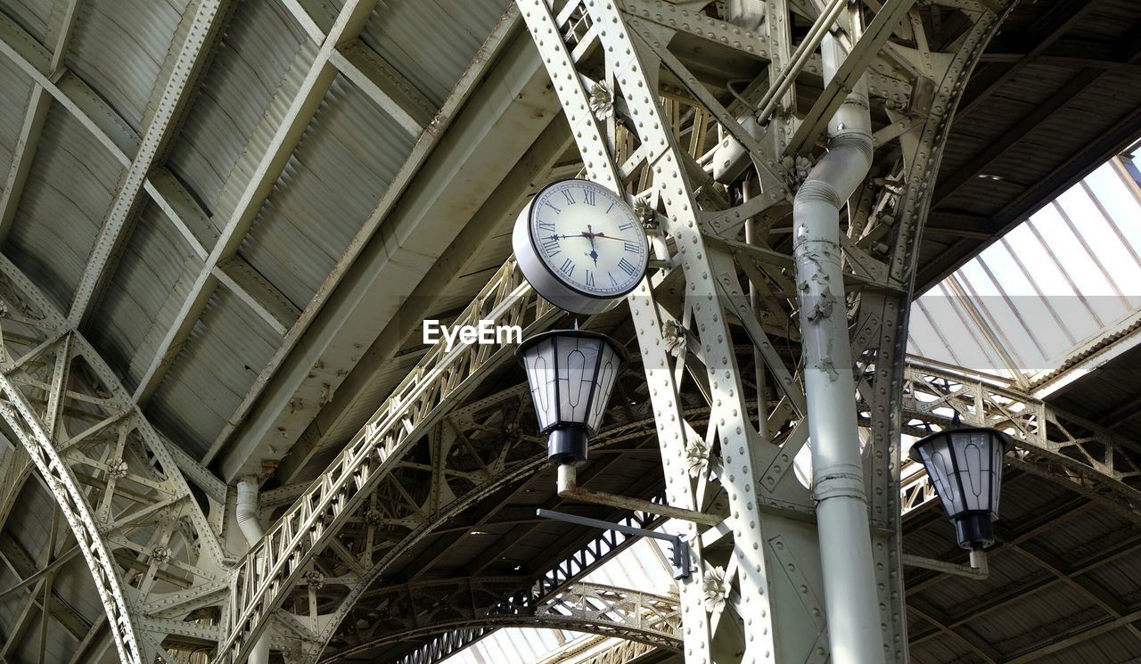 Low angle view of clock and lanterns at vitebsky railway station