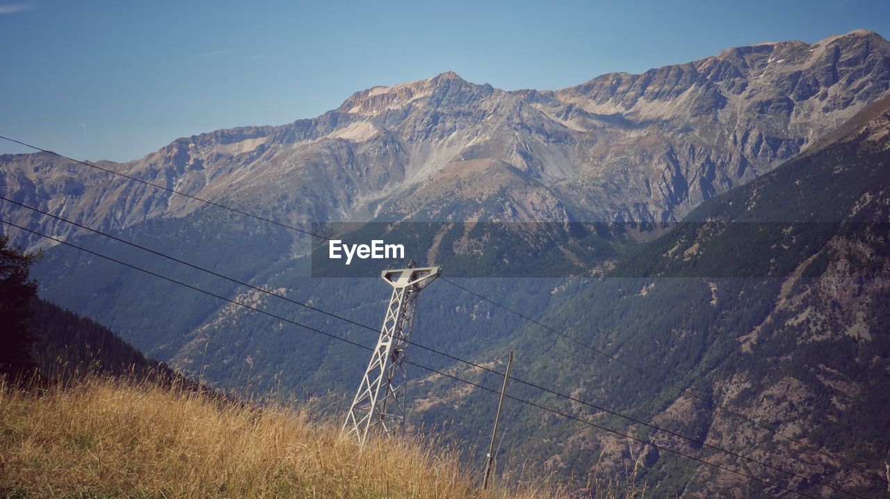 Mountains landscape with cableway trellis - vintage style photo 